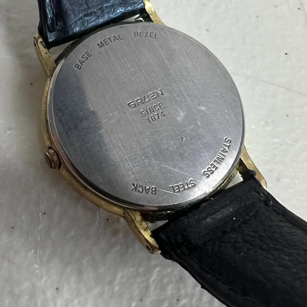 Gruen Mens Quartz Watch Gold Tone Roman Numeral White Dial Black Leather Strap